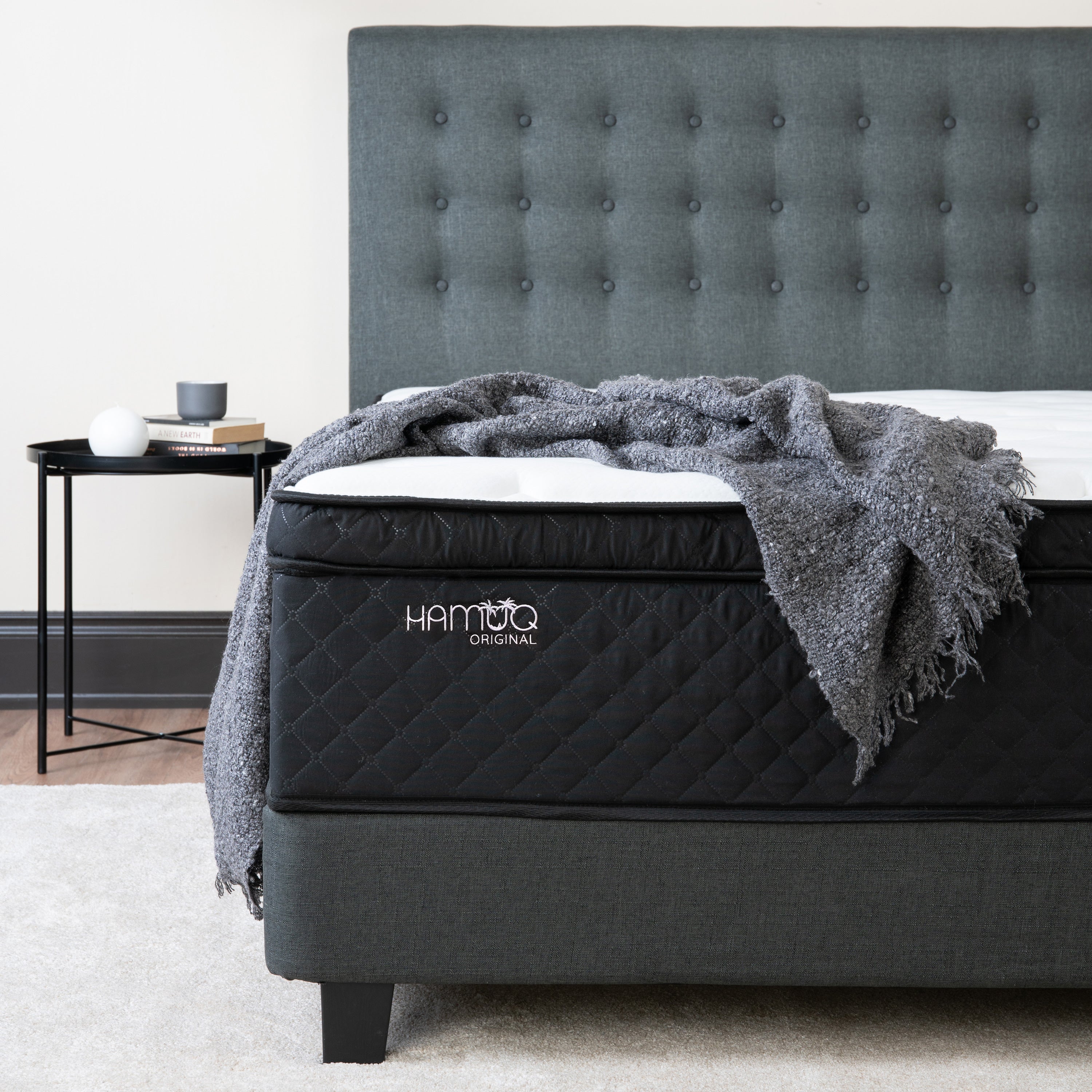 The Hamuq Original Hybrid Mattress on a bed frame in a Canadian bedroom